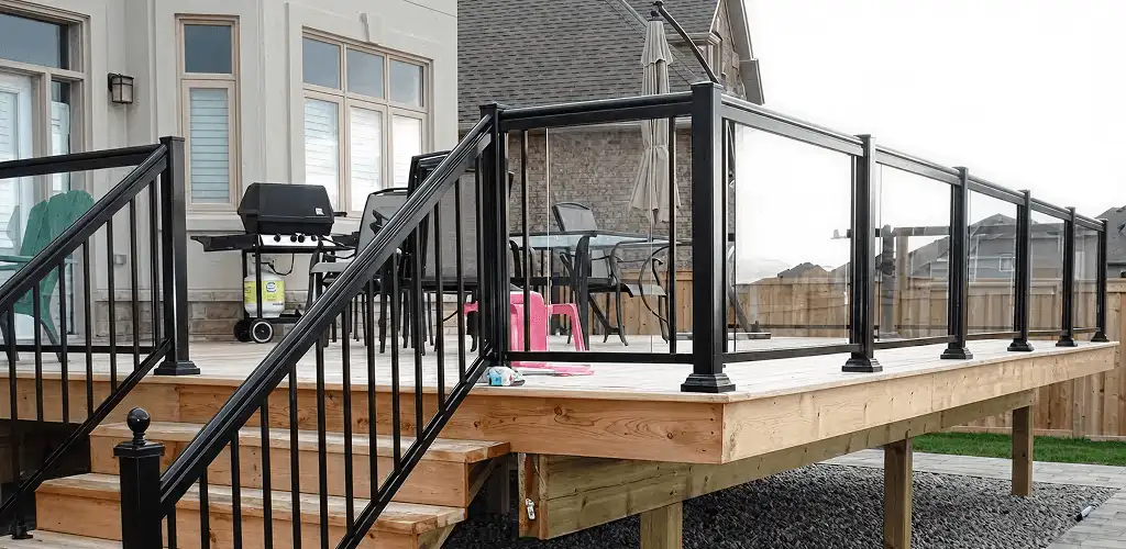 Handrail installation on a deck staircase for safety and code compliance in Tampa, FL